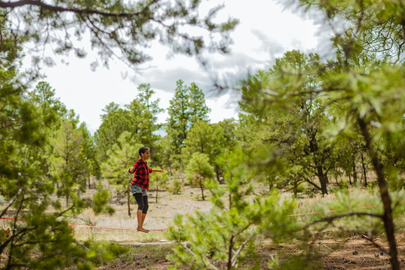 Woman stretching in the forest.
