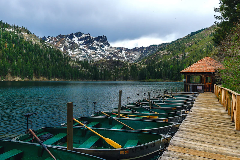 Row bocks docked on an alpine lake.