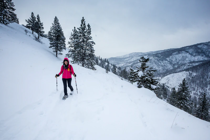 Woman snow shoeing,
