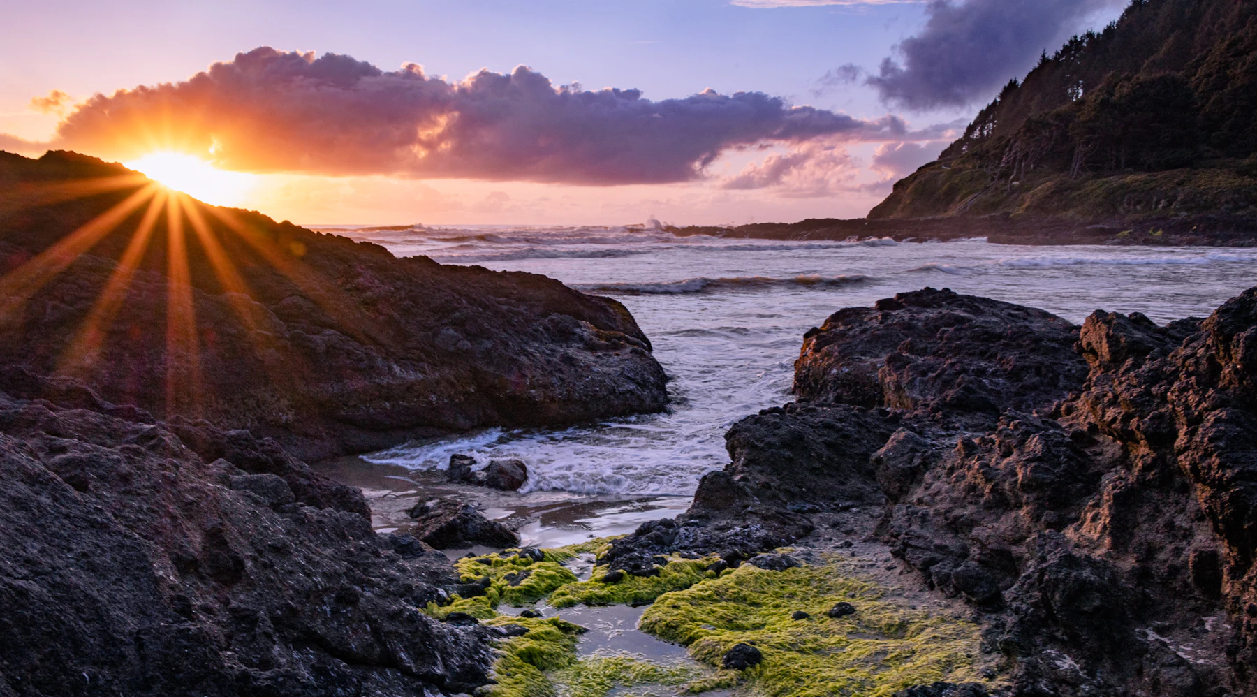 Sunset over the rocky shoreline.