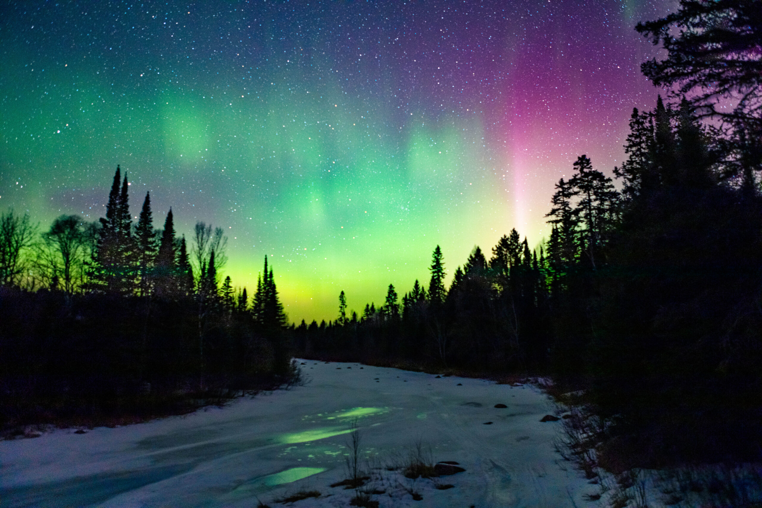 Aurora over an icy lake.