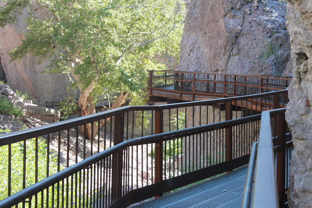 elevated walkway through desert canyon
