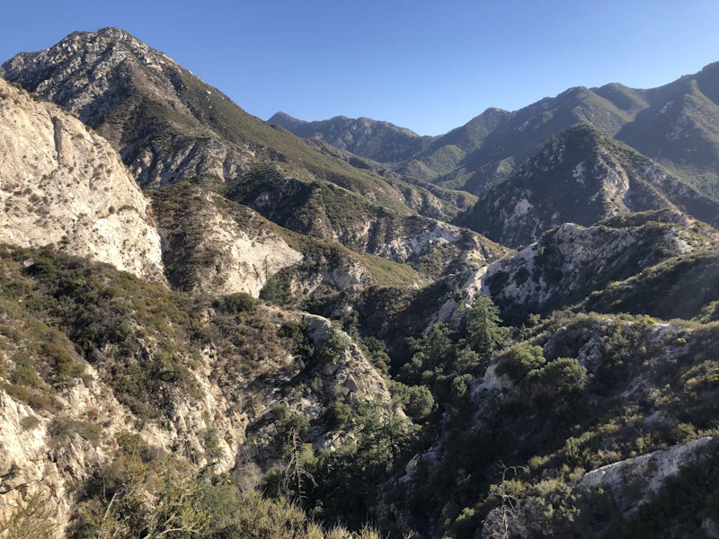 mountain valley beneath blue sky