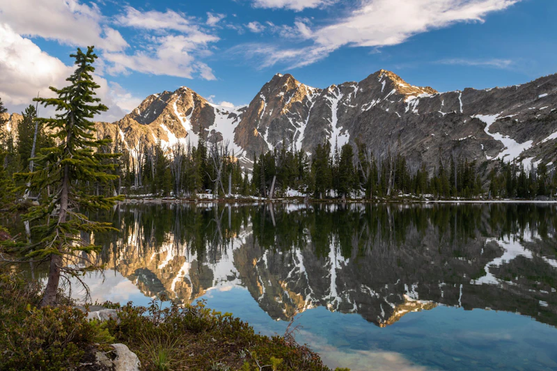 mountain peaks reflected in an alpine lake