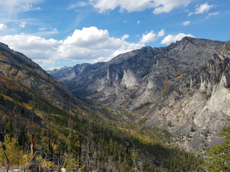 vast mountain valley and dramatic rocky cliffs