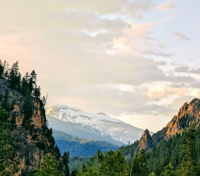 mountains through rocky cliffs at sunset