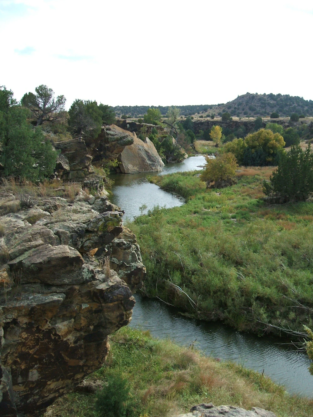 river beneath a rocky overlook