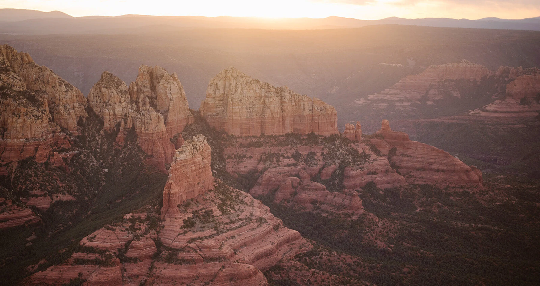 Rock formations rise out of a deep canyon.