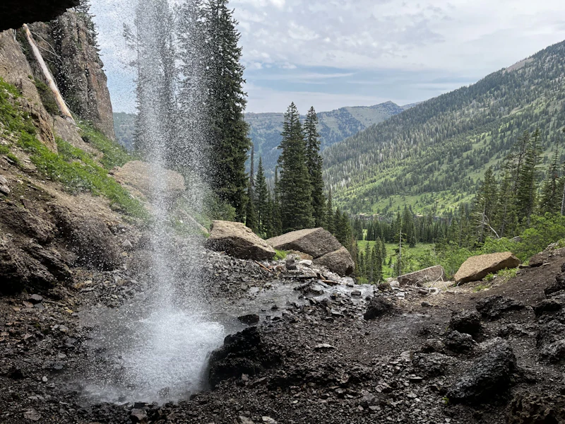 Mountain view through a waterfall.