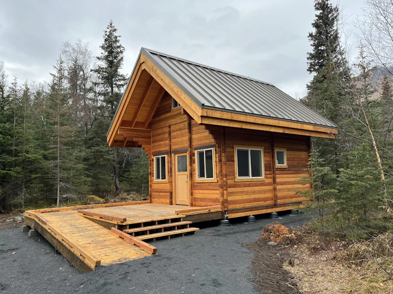 a new wooden cabin in the forest