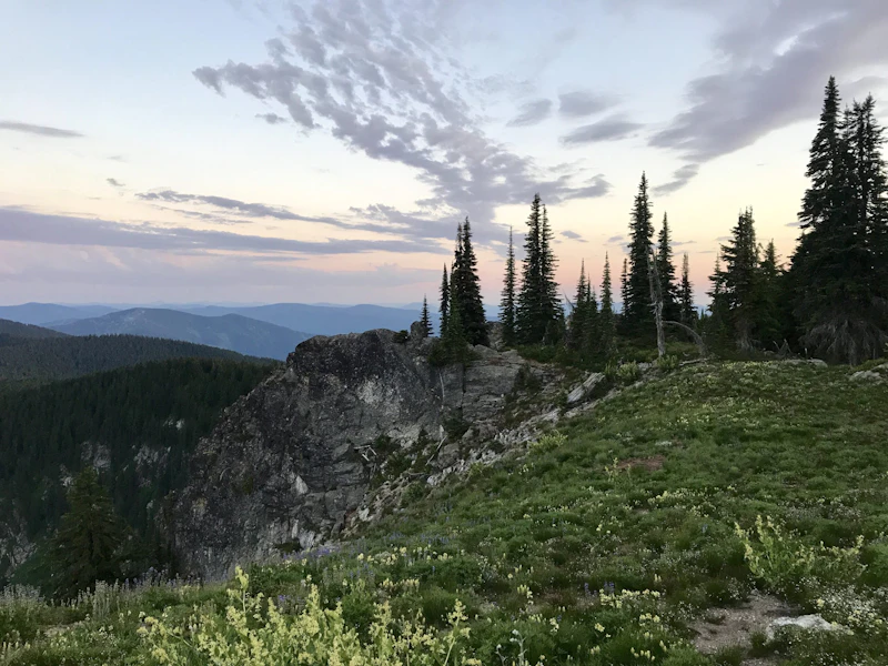 Sunset over a rocky cliff.