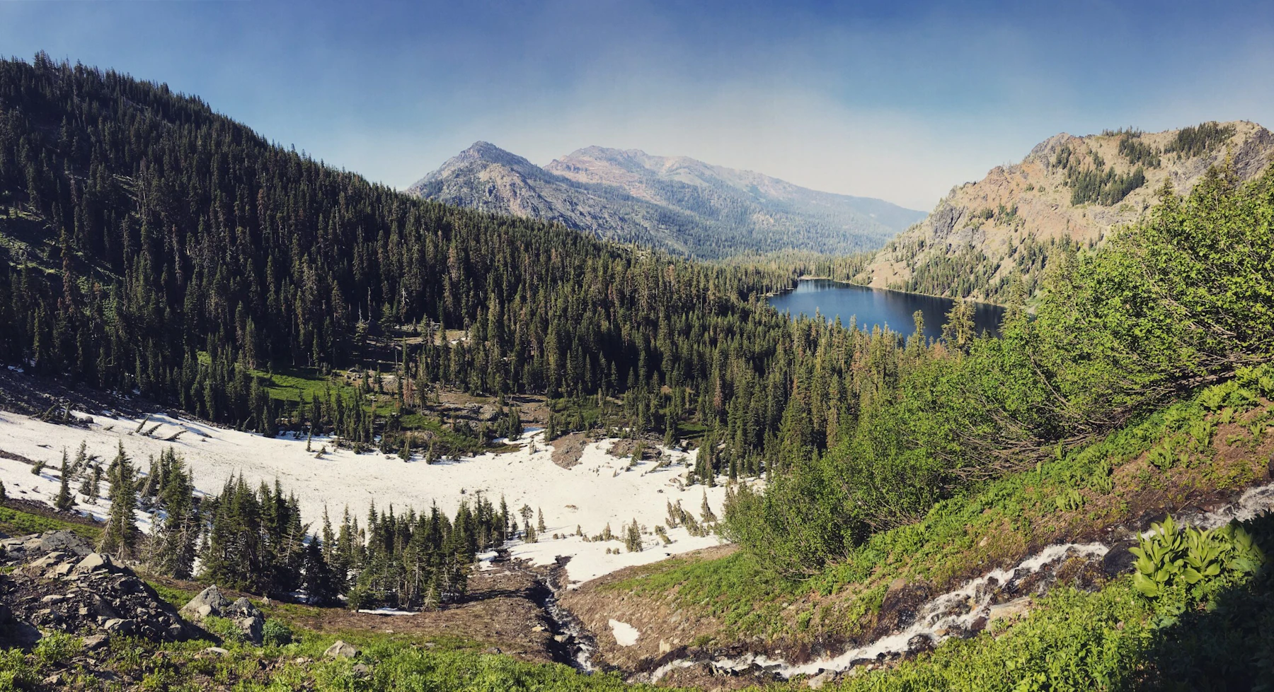 Mountain vista including an alpine lake.