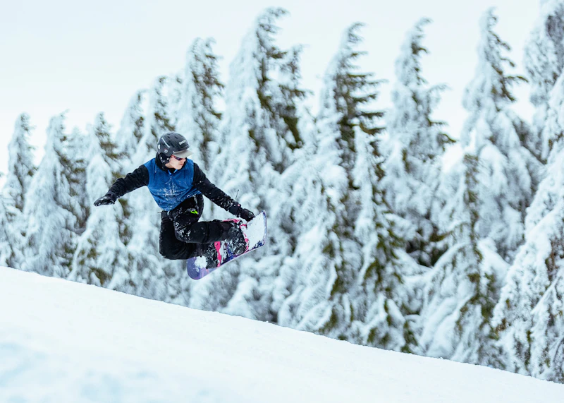 Snowboarding down the mountain.