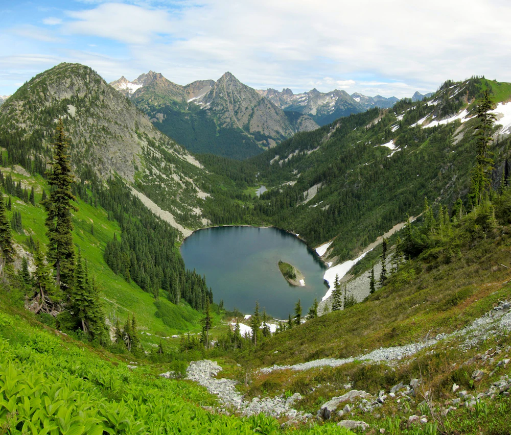 aerial view of a lake in the mountains
