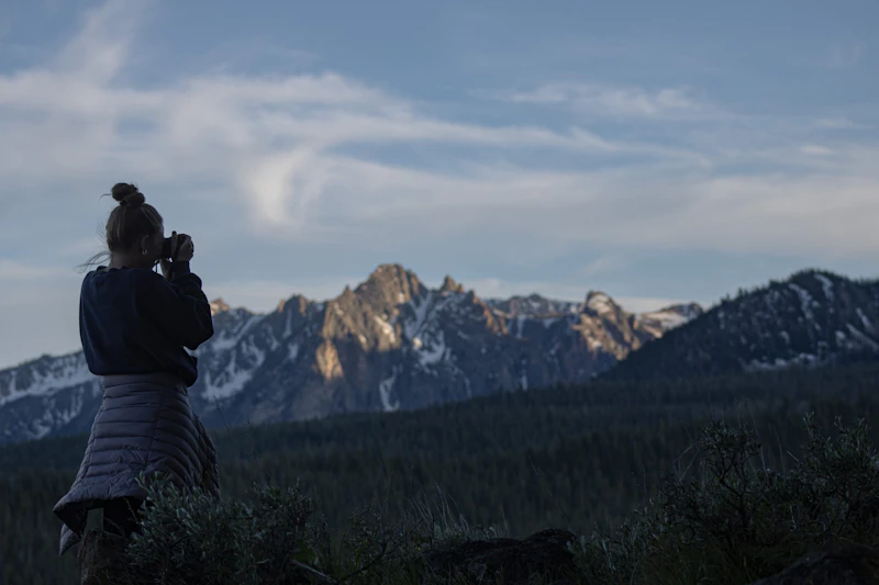 Photographer capturing mountain views.