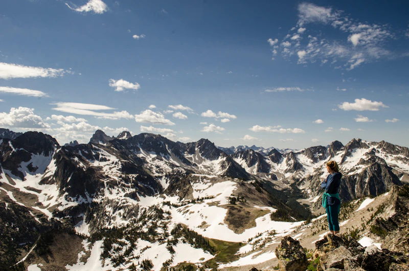 Hiker standing on a mountain summit.