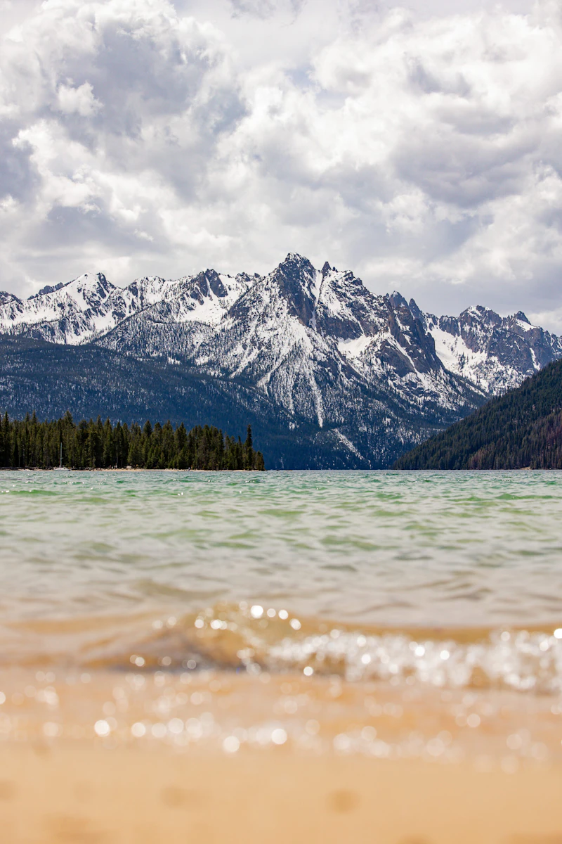 Lake view with snowy peaks rising in the distance.
