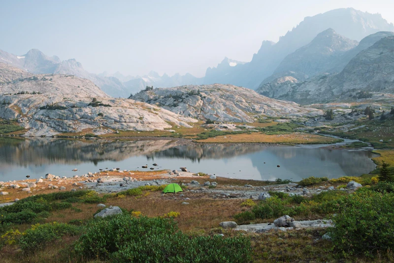 Camping on the edge of an alpine lake.