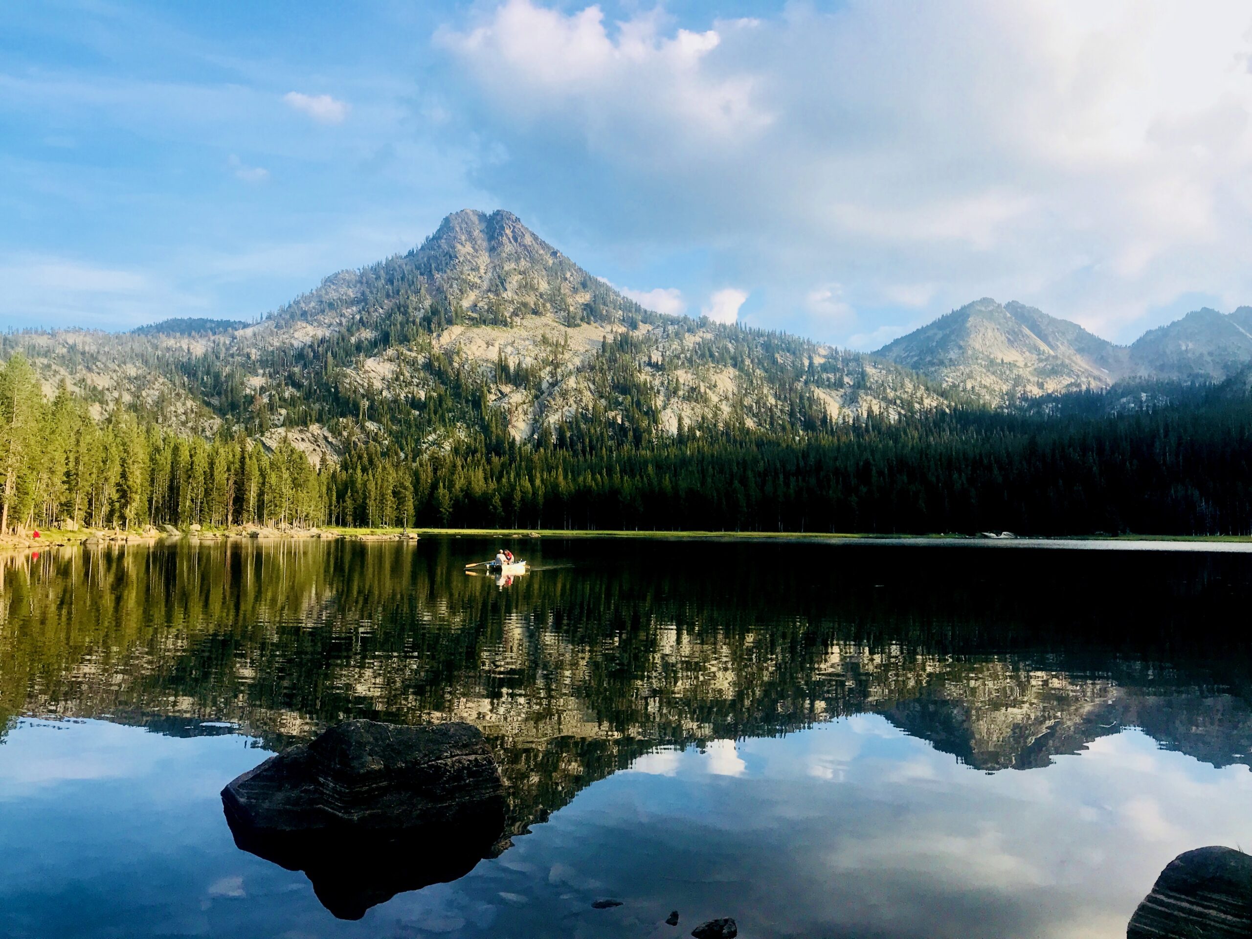 Rowboat on an alpine lake.