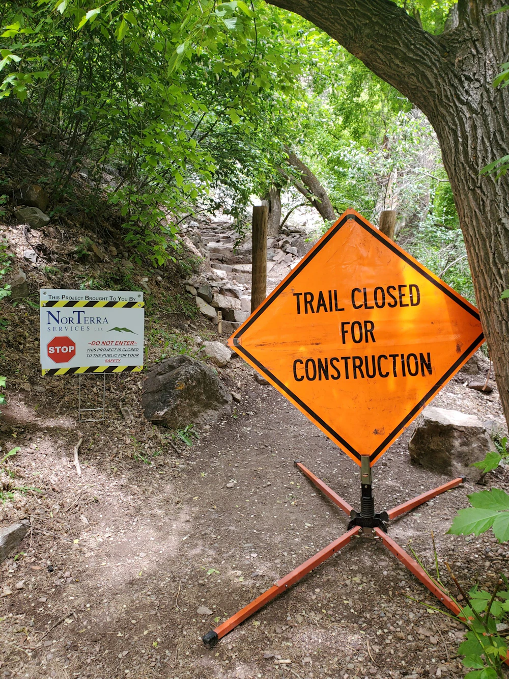 Sign that reads: "Trail Closed for Construction."